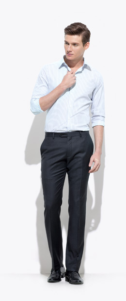 A model wearing an INDOCHINO pin-stripe custom shirt and black pants 2.