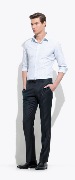 A model wearing an INDOCHINO pin-stripe custom shirt and black pants 3.
