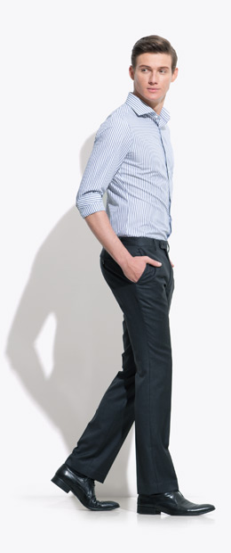 A model wearing an INDOCHINO pin-stripe custom shirt and black pants 6.
